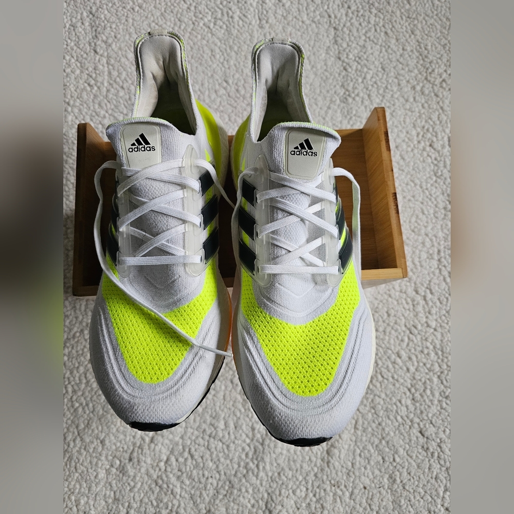 The Adidas Women's Ultraboost 21 Solar Yellow sneakers in US size 13 are a styli